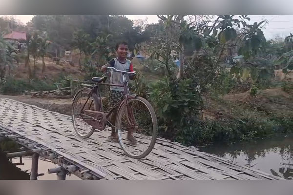 villagers in golaghati waiting for a concrete culvert