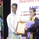 ace judoka asmita dey felicitated by tripura govt for gold in cwg cm hands over land allotment paper rs 10 lakh cheque